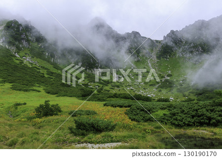 The green and misty mountain scenery of Senjojiki Cirque in summer 130190170