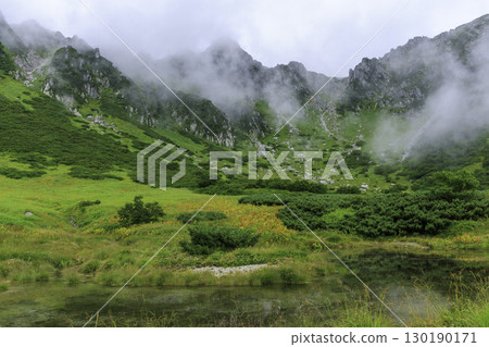 The green and misty mountain scenery of Senjojiki Cirque in summer 130190171