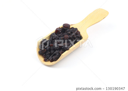 raisins in a scoop isolated on white background raisins in a scoop isolated on white background 130190347