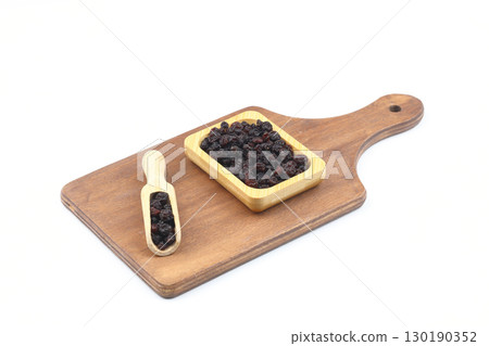 raisins in a scoop isolated on white background 130190352