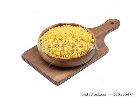 Italian pasta on a round dish isolated on a white background Italian pasta on a round dish isolated on a white background 130190474