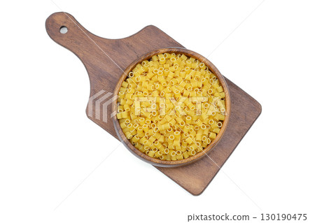 Italian pasta on a round dish isolated on a white background Italian pasta on a round dish isolated on a white background 130190475