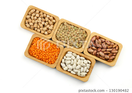 Different type of raw dry legumes composition. lentils, red lentils, chickpeas and kidney beans. Mix organic legume concept. Different type of raw dry legumes composition. lentils, red lentils, chickpeas and kidney beans. Mix organic legume concept. 130190482