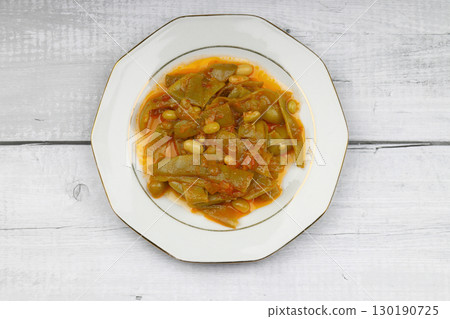 Homemade stewed green beans, tomatoes, garlic with olive oil. Zeytinyagli fasulye traditional food. Turkish cuisine. 130190725