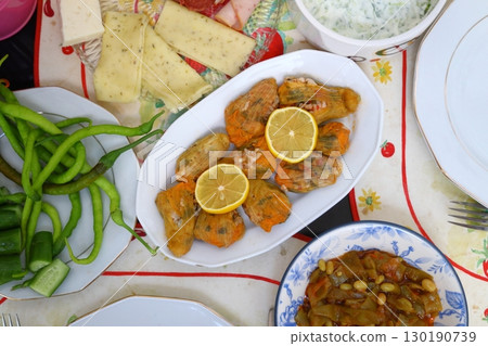 Pumpkin or Zucchini Flowers Dolma Stuffed with Rice Pilaf . Turkish Food in Plate. Traditional Organic Food. 130190739