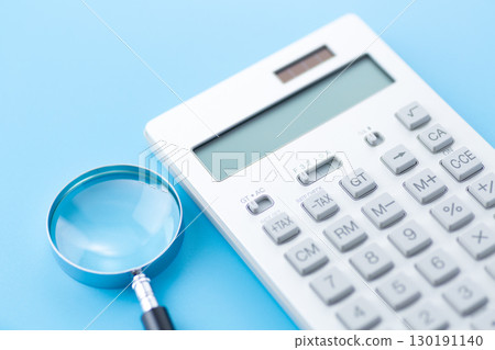 Calculator and magnifying glass Calculator and magnifying glass 130191140