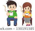 A young man relaxing while sitting in a chair and drinking coffee 130191385