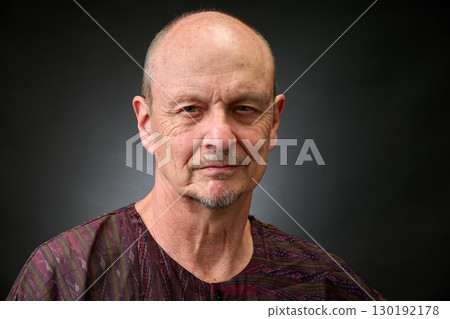 Closeup portrait of a senior man making funny faces Closeup portrait of a senior man making funny faces 130192178