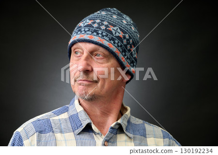 Closeup portrait of  senior with a blue winter Cap 130192234