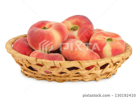 chinese flat donut peaches in a wicker basket isolated on white background chinese flat donut peaches in a wicker basket isolated on white background 130192410
