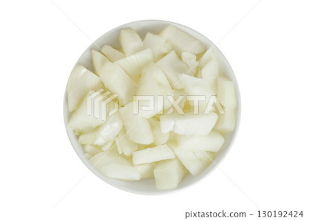 Onion slices in a ceramic bowl isolated on a white background. Top view. Flat lay. Onion slices in a ceramic bowl isolated on a white background. Top view. Flat lay. 130192424