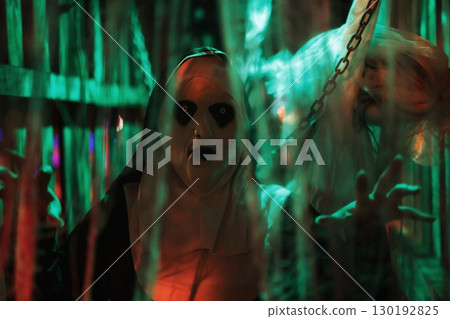 Scary devilish nun in cage with hang death bride. 2025 Halloween 130192825