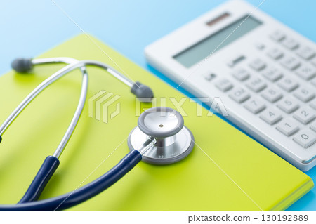 Blue stethoscope, binder and calculator Blue stethoscope, binder and calculator 130192889