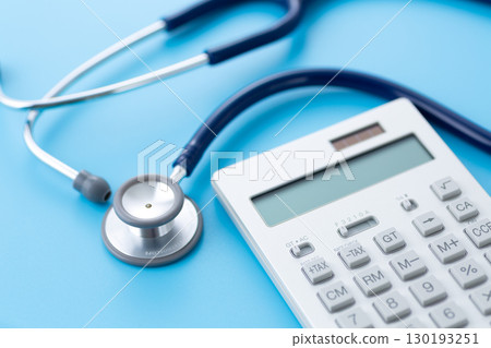 Blue stethoscope and calculator Blue stethoscope and calculator 130193251