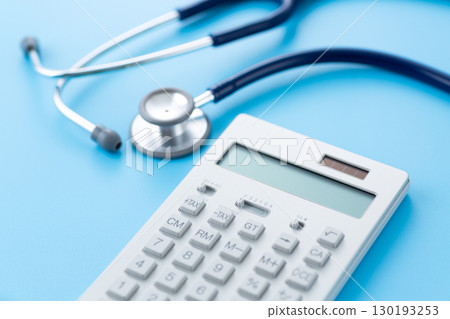 Blue stethoscope and calculator 130193253