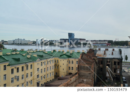 An Urban Landscape Showcasing a Picturesque Riverfront Alongside Historical Architecture 130193479