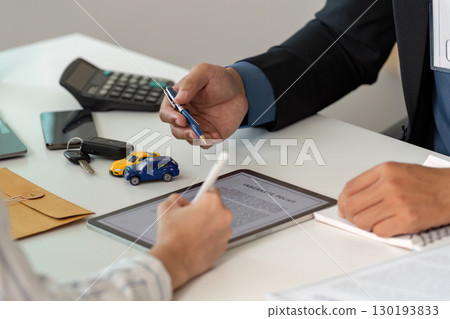 Insurance Policy Consultation. Discussing car insurance with a client. 130193833