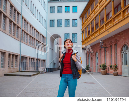 woman walks through old town of Frankfurt woman walks through old town of Frankfurt 130194794