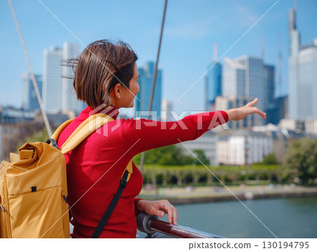Tourist woman explores modern Frankfurt, 130194795