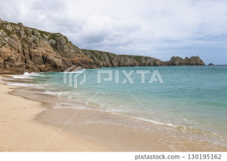 Porthcurno Beach, Cornwall UK with wide golden sand and clear Atlantic water 130195162