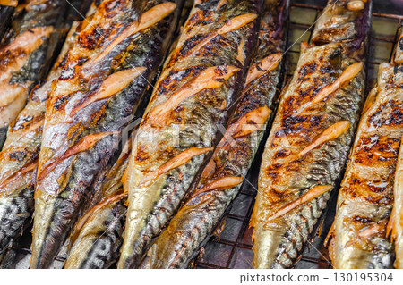 fried fish mackerel, street food, close-up, selective focus 130195304