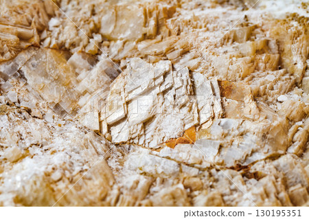 Icelandic spar layers in rock, close-up, selective focus 130195351