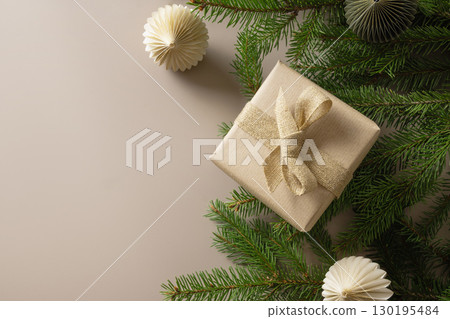 Christmas banner with craft gift, paper eco friendly gift and festive composition on beige background. 130195484