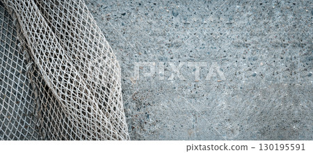 Fishing Net on Concrete Background 130195591