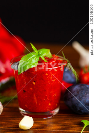 classic homemade red adjika with hot pepper and spices 130196106
