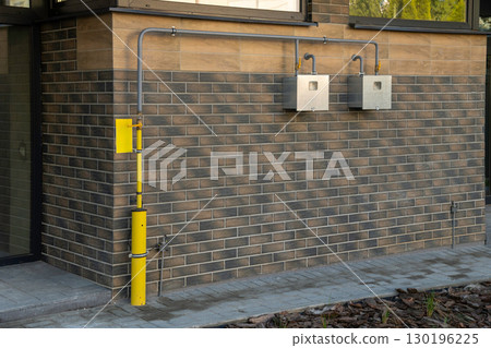 Gas pipeline and meters installation in a modern two-apartment townhouse Gas pipeline and meters installation in a modern two-apartment townhouse 130196225