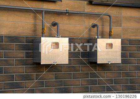 Gas pipeline and meters installation in a modern two-apartment townhouse Gas pipeline and meters installation in a modern two-apartment townhouse 130196226