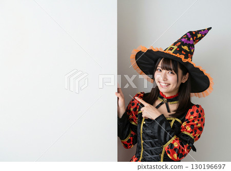A woman dressed as a witch on a white background 130196697