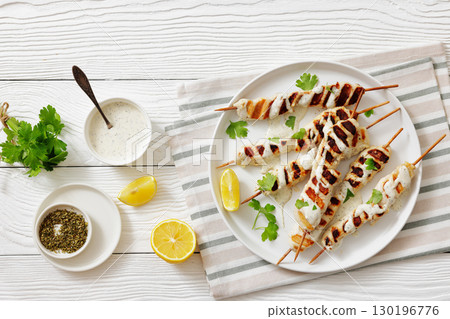 Greek style grilled chicken souvlaki on a plate 130196776
