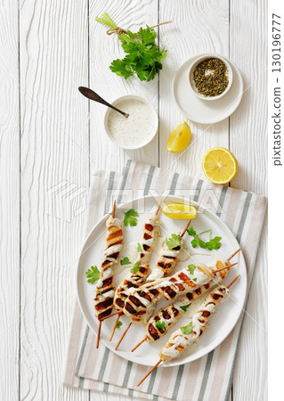 Greek style grilled chicken souvlaki on a plate Greek style grilled chicken souvlaki on a plate 130196777