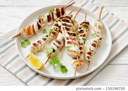 Greek style grilled chicken souvlaki on a plate 130196780