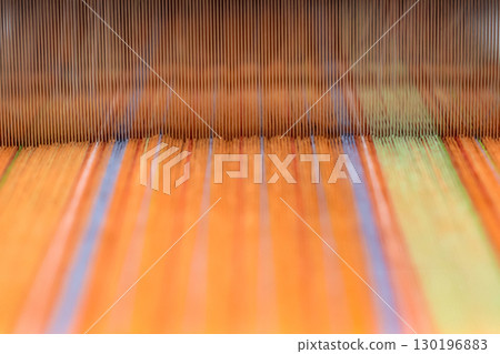 Background of colorful warp threads on a loom 130196883