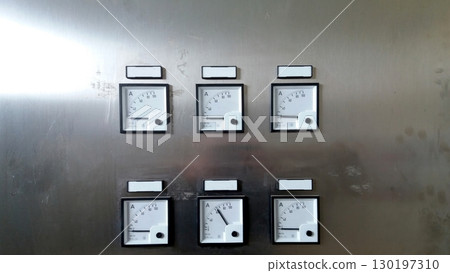 Cabinet Panel Displaying Multiple Ammeters for Electrical Current Measurement 130197310