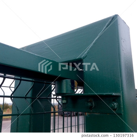 Detail of a Robust Rolling Gate Mechanism Showcasing Durability and Design at a Storage Facility 130197316