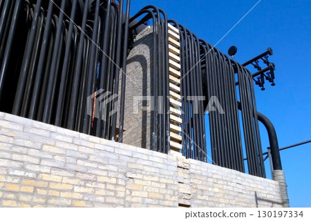 Installation of a Steam Boiler Featuring Extensive Piping and Masonry Details 130197334