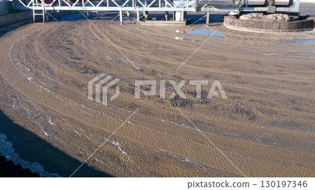 Surface of Water Covered With Mud in Treatment Plant During Processing Activities in Daylight Surface of Water Covered With Mud in Treatment Plant During Processing Activities in Daylight 130197346
