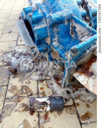 Submersible Pump for Cleaning Surrounded by Debris on a Tiled Surface Submersible Pump for Cleaning Surrounded by Debris on a Tiled Surface 130197366