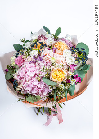 Bouquet of fresh delicate flowers on a white background gift Bouquet of fresh delicate flowers on a white background gift 130197494