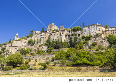 Montbrun les Bains dominating the landscape in Drome, France, under a clear blue sky Montbrun les Bains dominating the landscape in Drome, France, under a clear blue sky 130197634