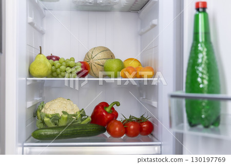 Open Refrigerator Filled with Fresh Fruits, Vegetables and Drinks Open Refrigerator Filled with Fresh Fruits, Vegetables and Drinks 130197769