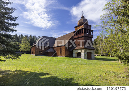 Wooden Articular Church standing in green meadow in Svaty Kriz, Slovakia 130197773