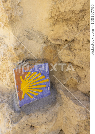 Camino de Santiago scallop shell marking the way in Castrojeriz, Spain Camino de Santiago scallop shell marking the way in Castrojeriz, Spain 130197796