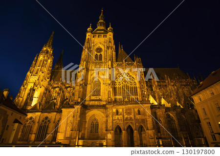 St. Vitus Cathedral illuminating Prague Castle at night 130197800