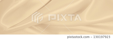 Smooth elegant golden silk or satin luxury cloth texture as wedding background. Luxurious Christmas background or New Year background design. In Sepia toned. Retro style Smooth elegant golden silk or satin luxury cloth texture as wedding background. Luxurious Christmas background or New Year background design. In Sepia toned. Retro style 130197923