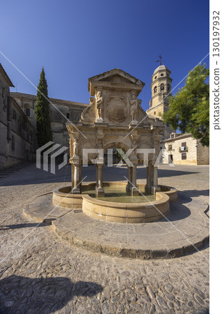 Fountain of Lions illuminating Plaza de Santa Maria in Baeza, Spain 130197932