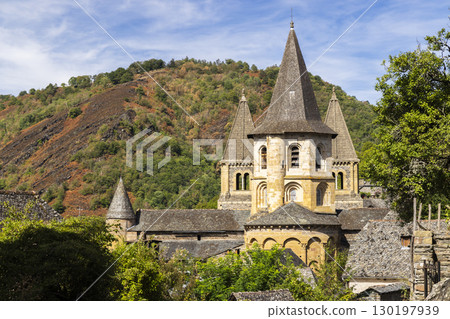 Sainte Foy Abbey Church dominating Conques en Rouergue in Aveyron, France Sainte Foy Abbey Church dominating Conques en Rouergue in Aveyron, France 130197939
